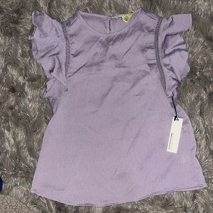 Light purple top with ruffle sleeve